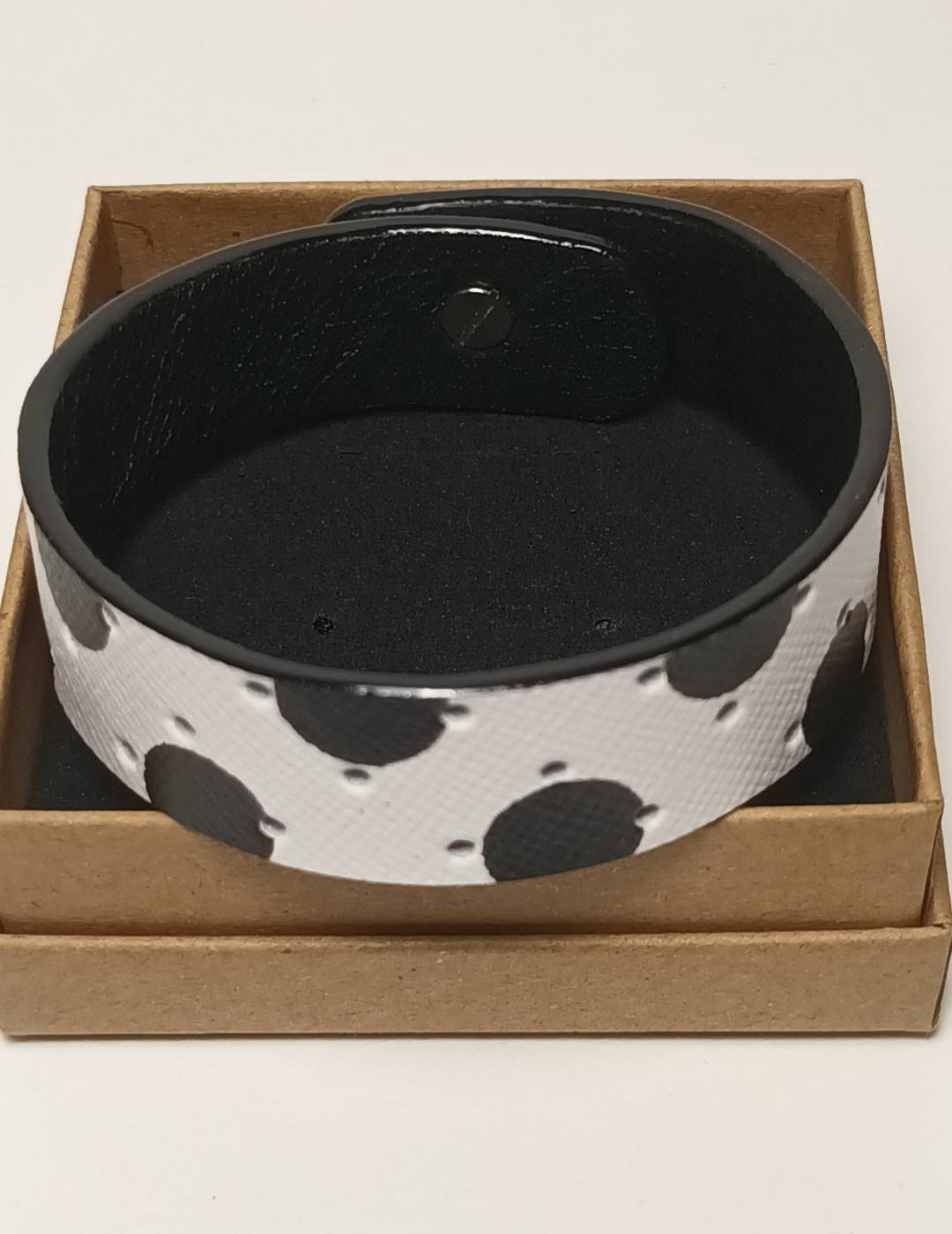 Bracelet blanc à pois noirs