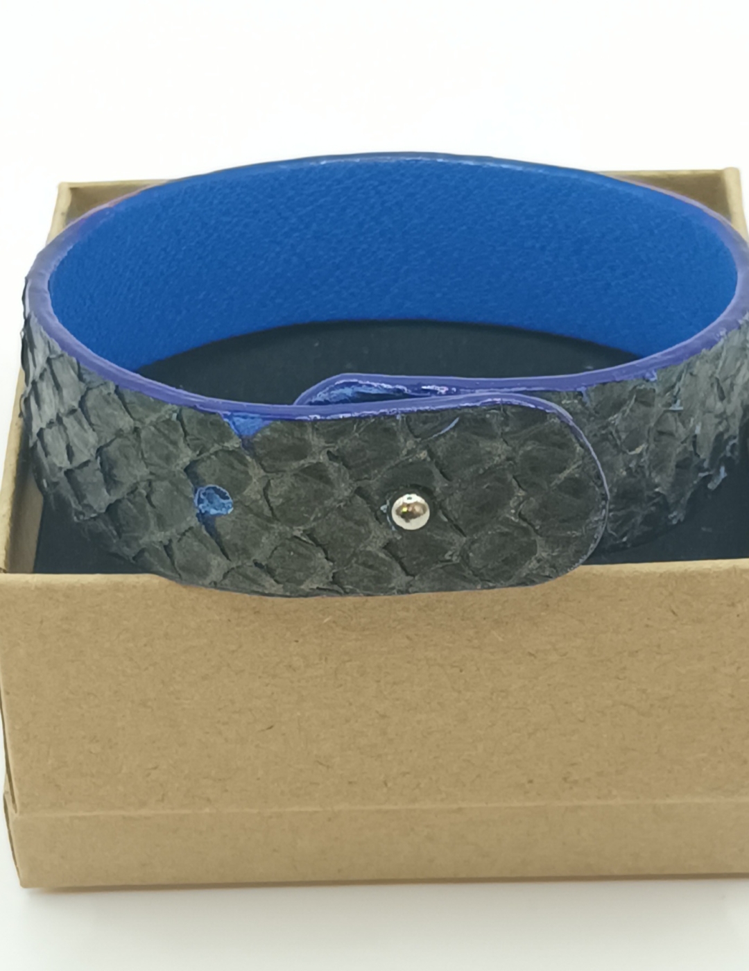 Bracelet bleu aux reflets bronze en saumon